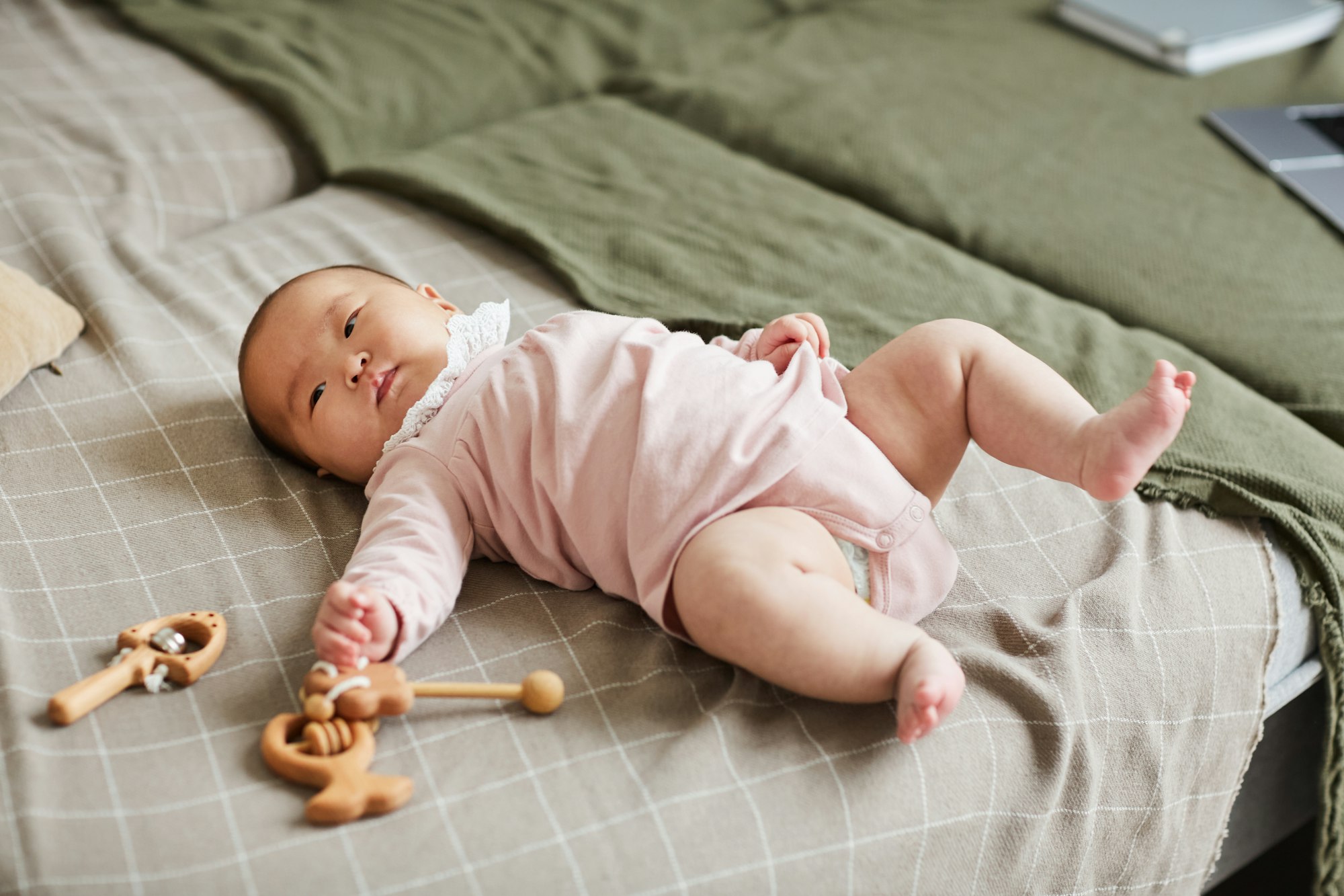Baby girl lying on the bed